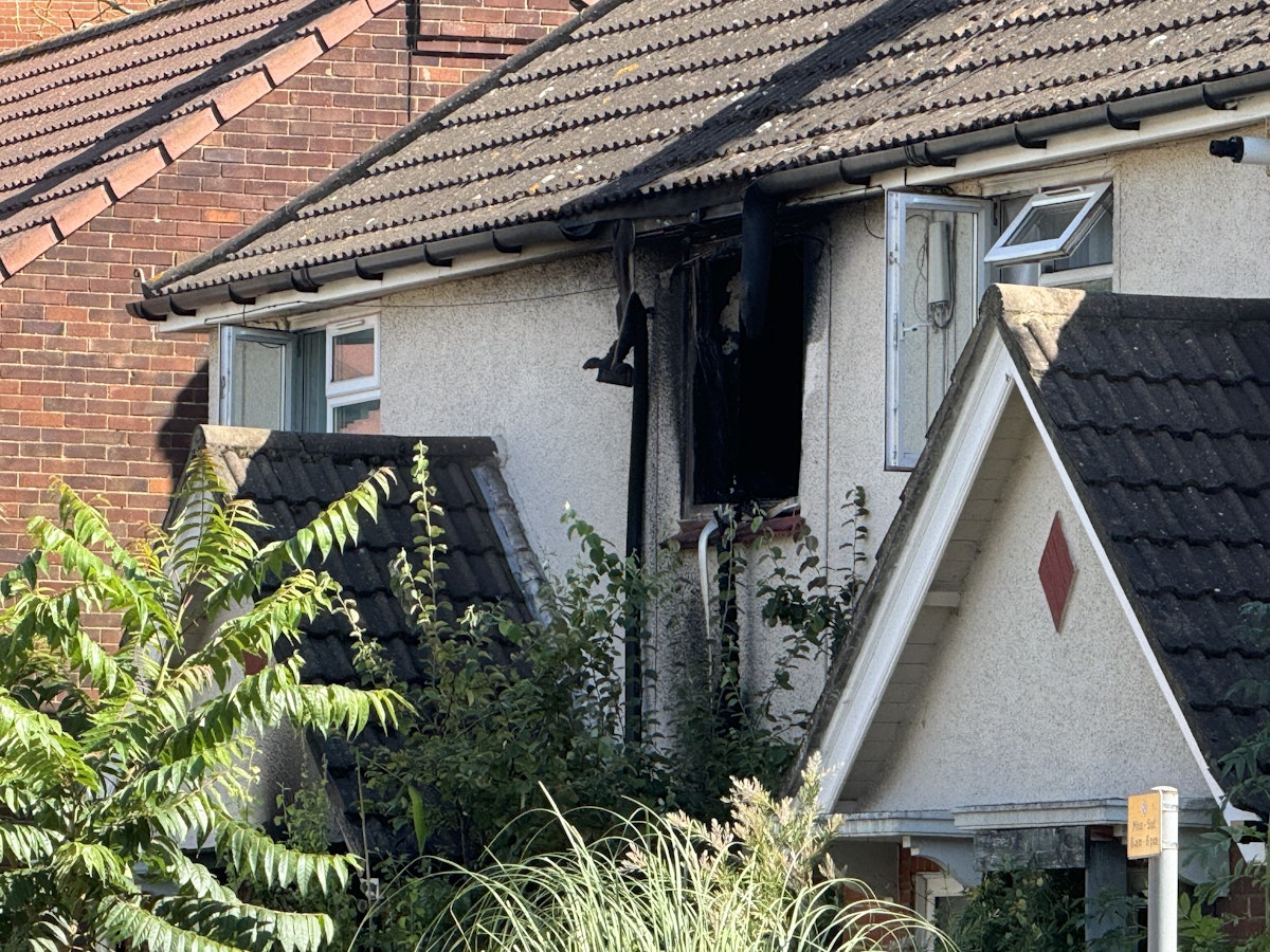 A burnt out window of a house on Portman Road